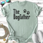 Light mint green t-shirt with black text "The Dogfather" and paw prints.