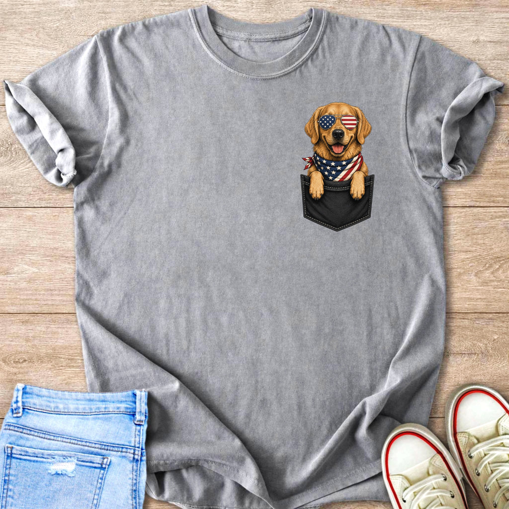 Golden retriever wearing American flag bandana and sunglasses peeking from a pocket.