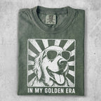 T-shirt with a white graphic of a golden retriever wearing sunglasses with radiating lines.