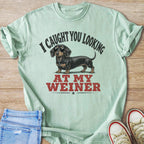 Mint t-shirt with a dachshund wearing sunglasses and text "I CAUGHT YOU LOOKING AT MY WEINER".