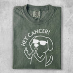 Green t-shirt with dog graphic saying "Hey Cancer!" and flipping off middle finger.