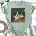 Black and white dog wearing a blue baseball cap, being poured a beer.