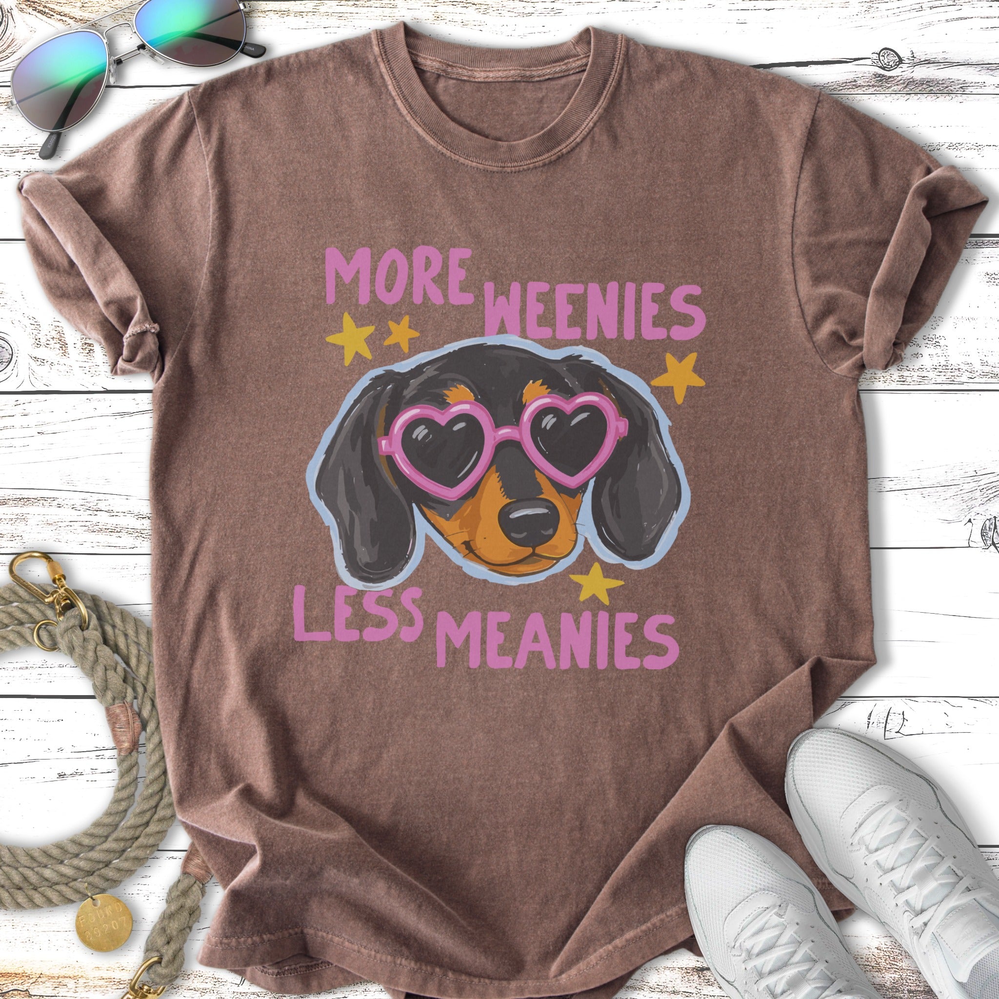 Brown t-shirt with "More Weenies Less Meanies" and a dachshund wearing heart sunglasses.