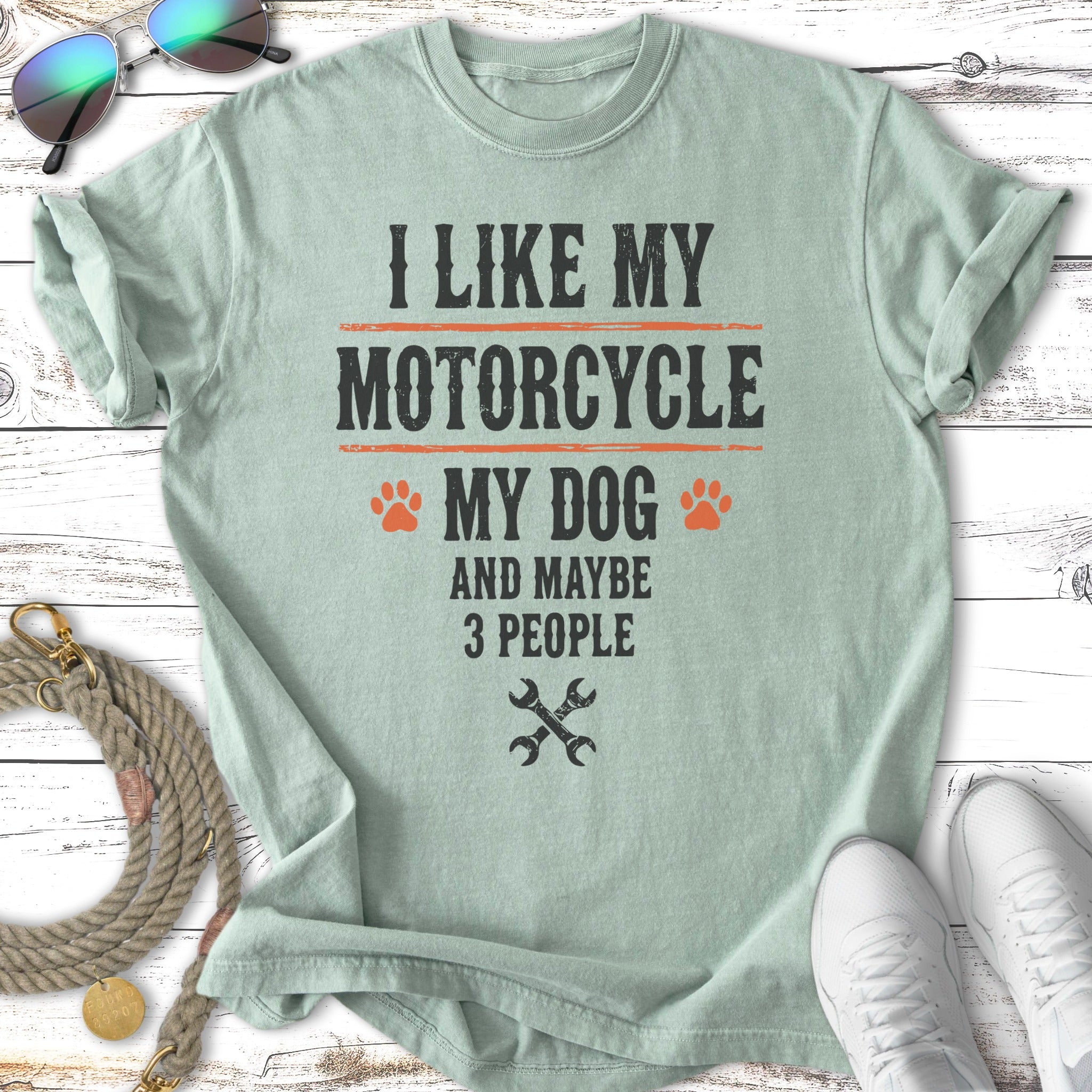 Light green t-shirt with "I like my motorcycle, my dog, and maybe 3 people" text.