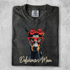 Doberman Mom t-shirt with heart-shaped glasses and red bow.