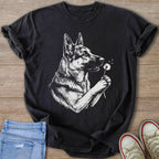 Black t-shirt with a white sketch of a German Shepherd holding a dandelion.