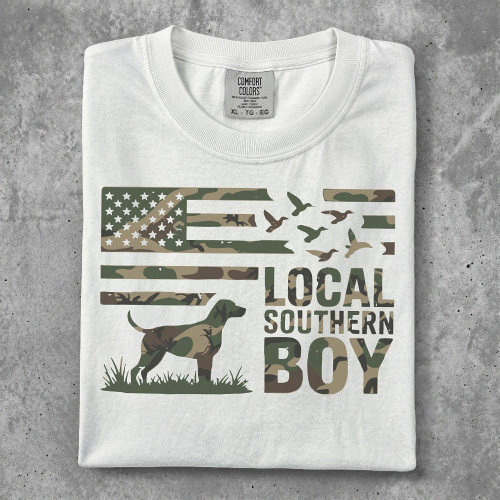 White t-shirt with camouflage US flag, dog, and text "LOCAL SOUTHERN BOY."