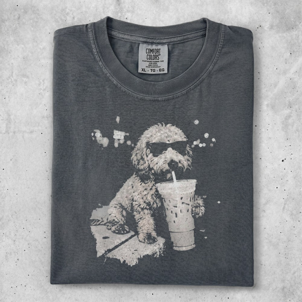 T-shirt with graphic of a dog in sunglasses drinking an iced coffee.