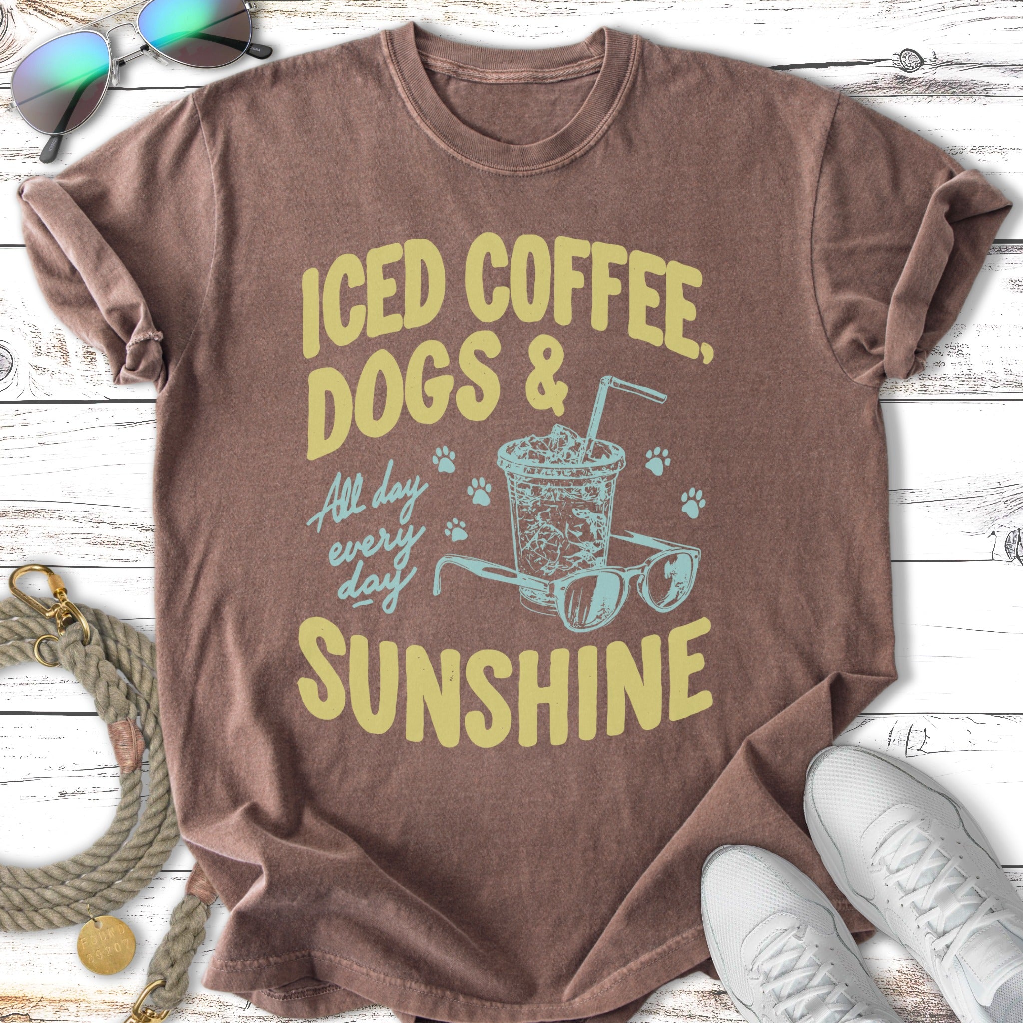Brown t-shirt with "Iced Coffee, Dogs & Sunshine" text and sunglasses graphic.