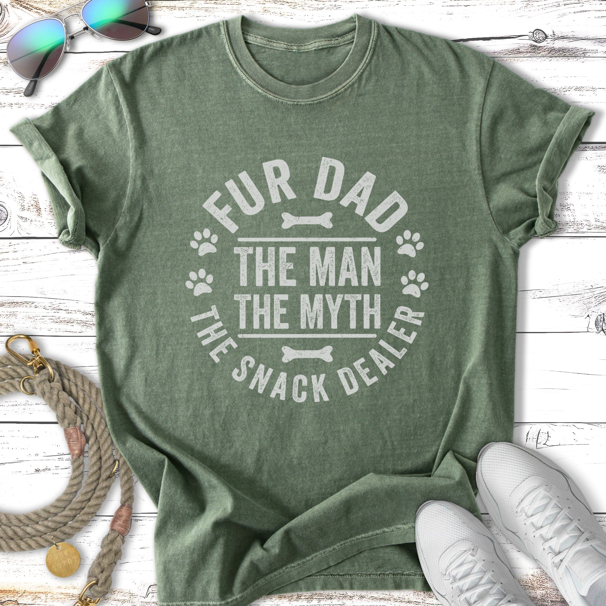Green t-shirt with "Fur Dad The Man The Myth The Snack Dealer" text and paw prints.