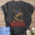 German Shepherd wearing American flag bandana and sunglasses, text Merica