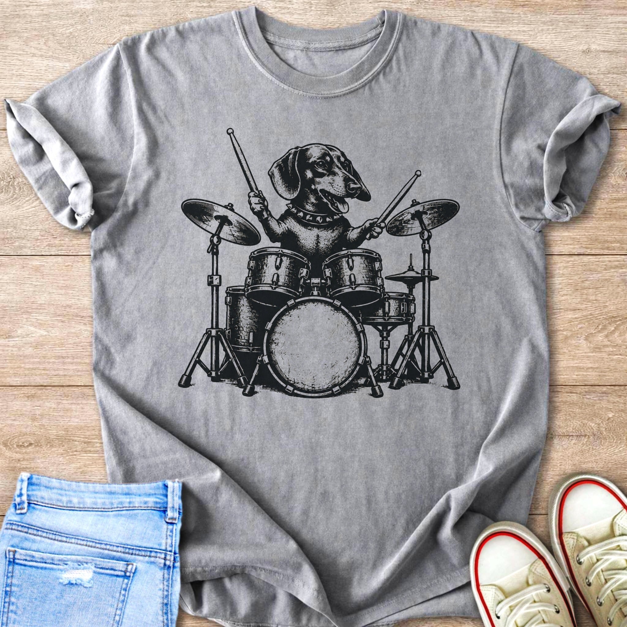Dachshund dog playing drums on a grey t-shirt.