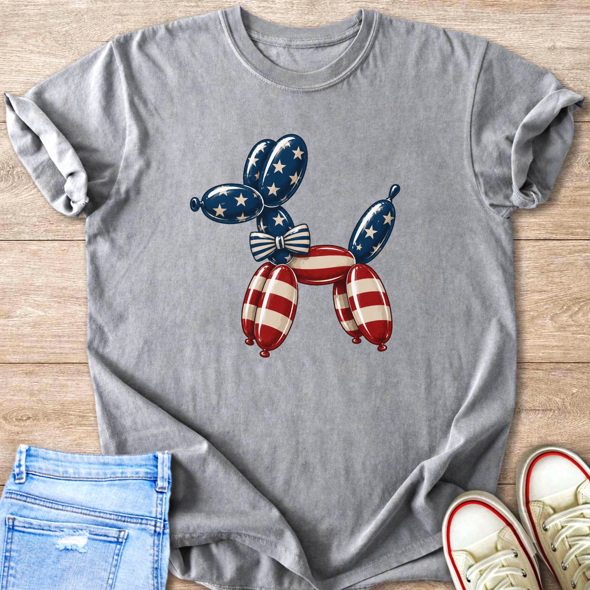 T-shirt with patriotic balloon dog graphic in red, white, and blue.
