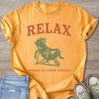 Orange t-shirt with "RELAX, NOTHING IS UNDER CONTROL" and dog graphic.