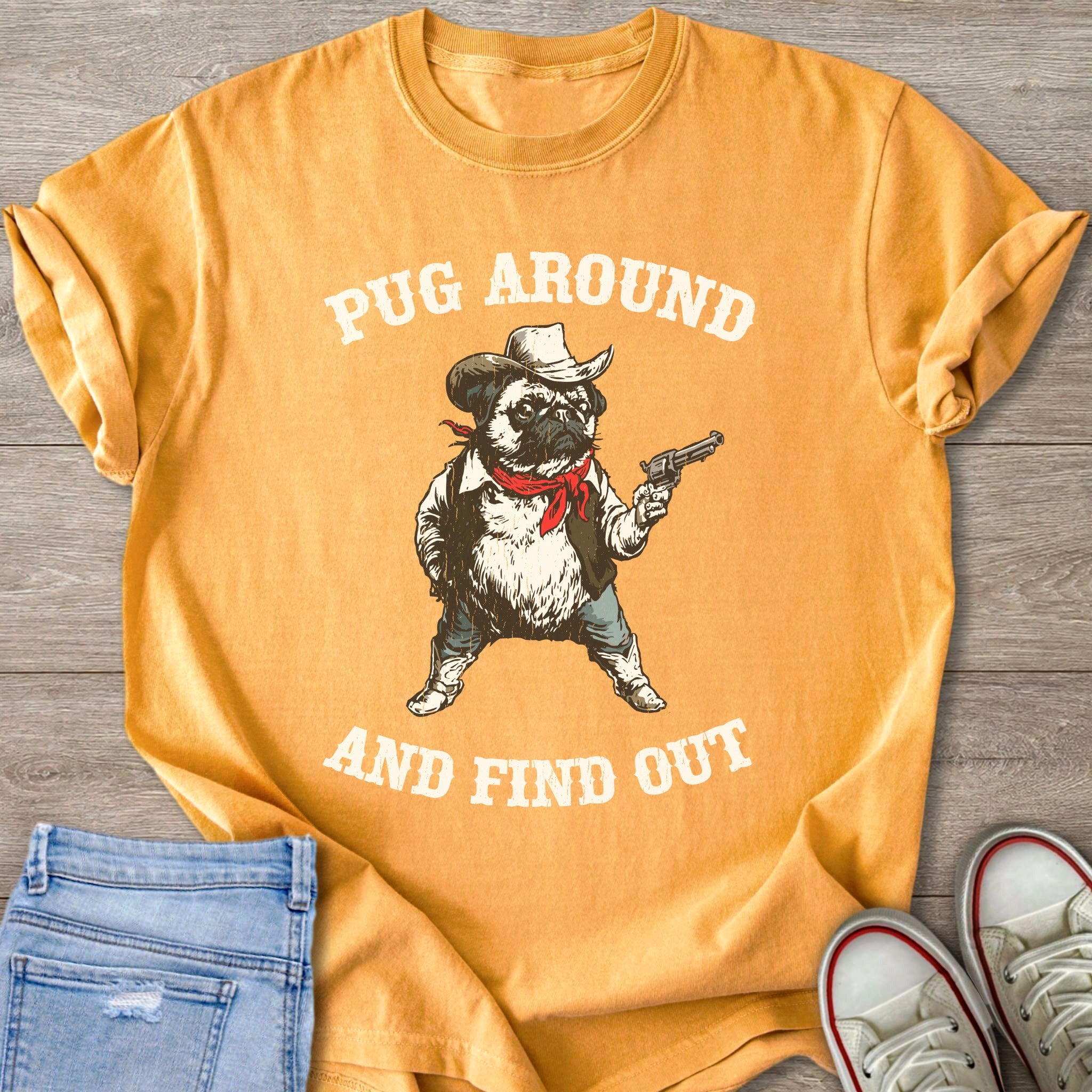 Yellow t-shirt with pug in cowboy hat holding a gun, text "Pug Around and Find Out".