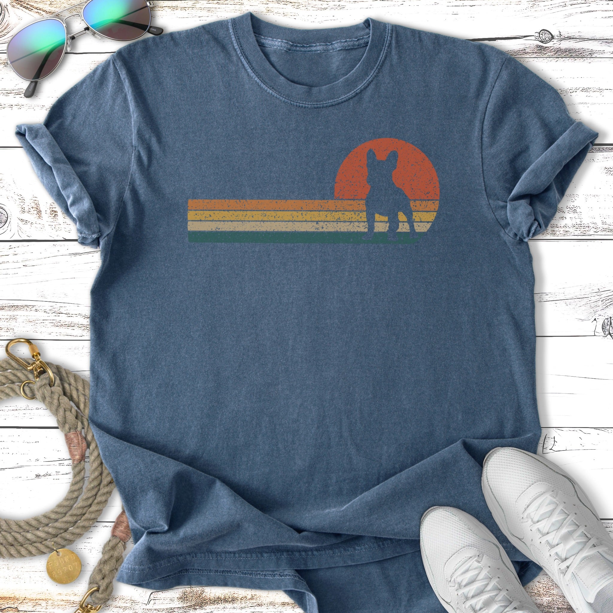 T-shirt with vintage sunset graphic of a French bulldog silhouette.
