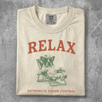Cream t-shirt with "RELAX" and a dog lounging in a chair.