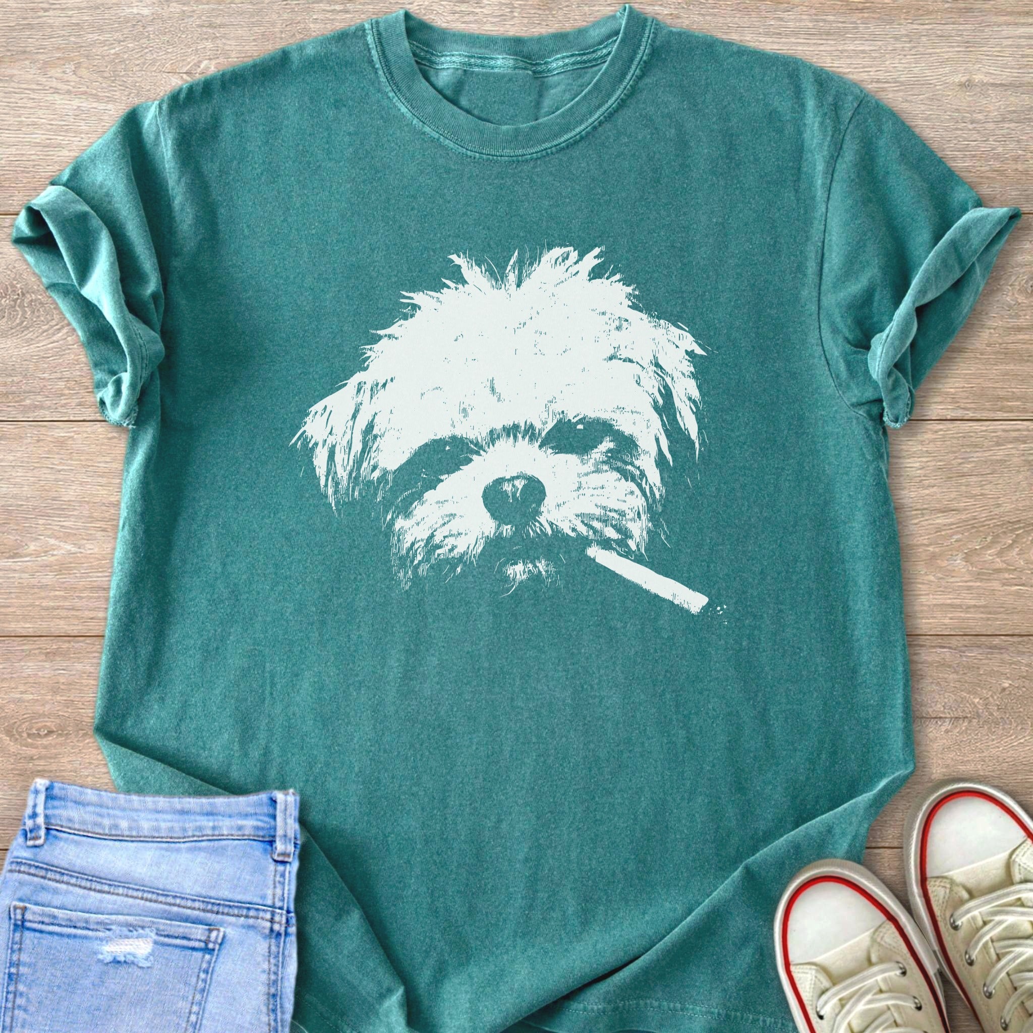 Teal t-shirt with white graphic of a dog's head with a cigarette.