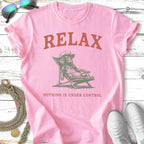 Pink t-shirt with "RELAX NOTHING IS UNDER CONTROL" text and illustration.
