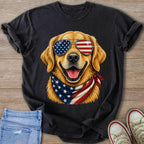 Golden retriever wearing American flag sunglasses and bandana on black t-shirt.