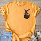 Chihuahua in American flag bandana and sunglasses peeking from a pocket.