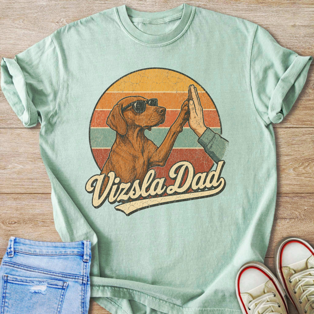 Vizsla dog wearing sunglasses gives human hand a high five, text "Vizsla Dad".