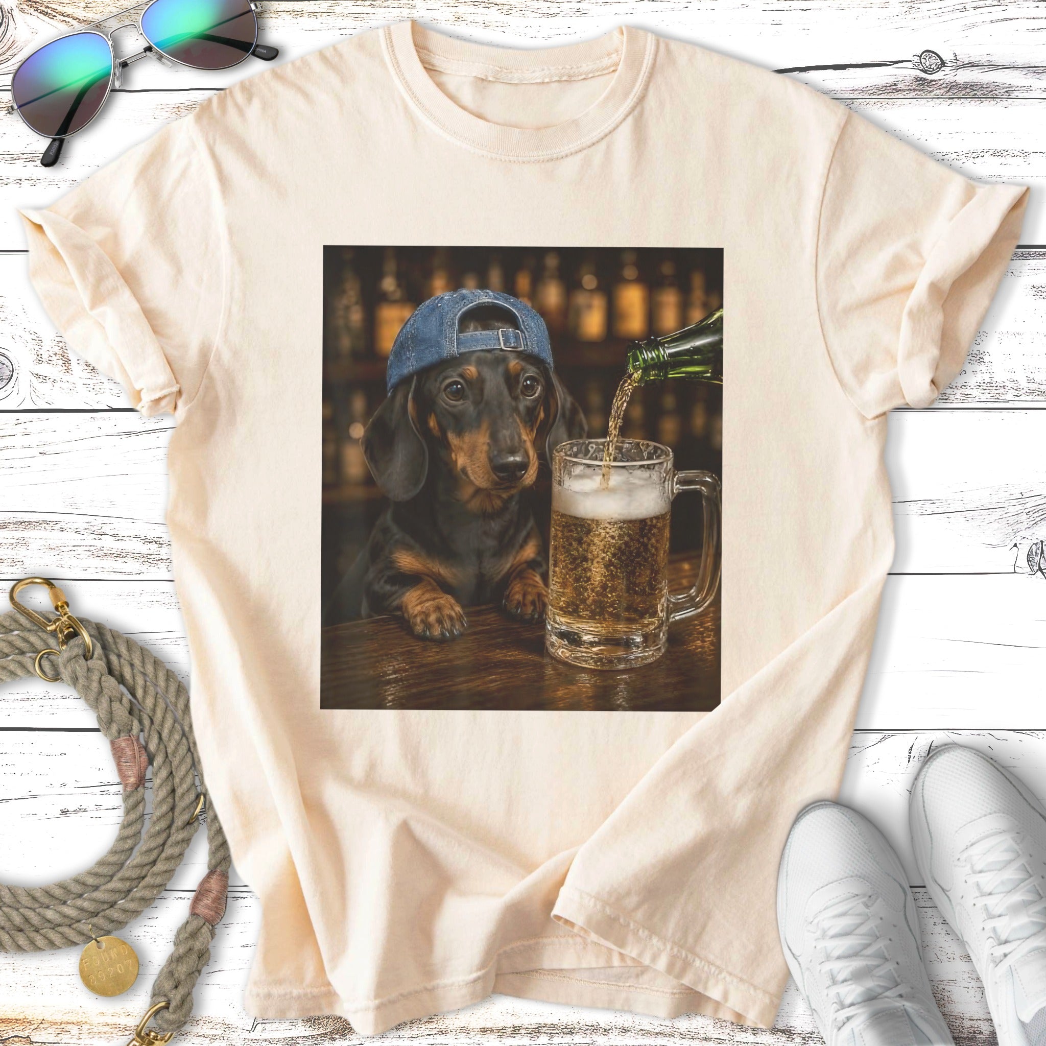 Dachshund wearing a blue baseball cap drinks beer at a bar.
