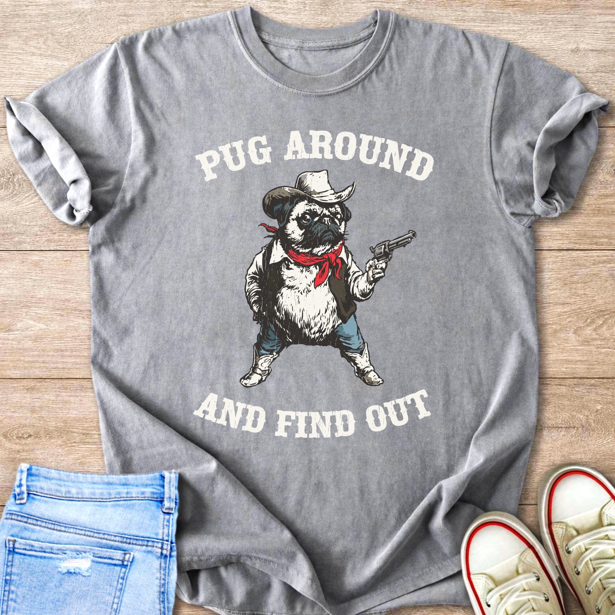 Grey t-shirt with a pug wearing a cowboy hat and holding a gun, text reads "Pug Around and Find Out".