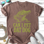 Green alligator graphic on brown t-shirt with "CAN I PET DAT DOG" text.