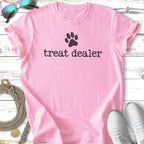 Pink t-shirt with "treat dealer" and a paw print in black.