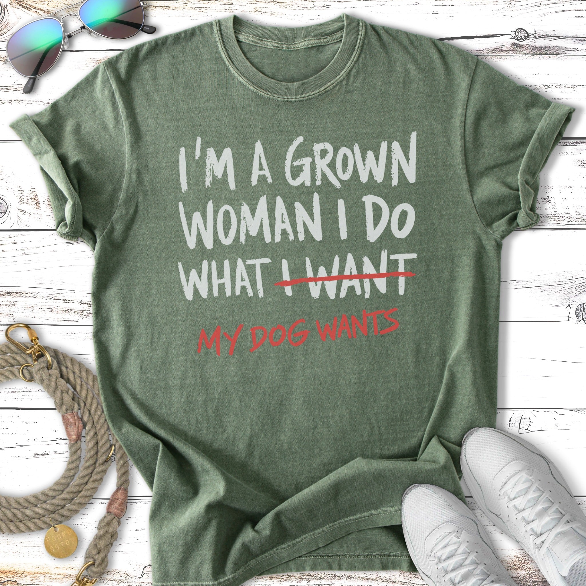 Green t-shirt with white text "I'm a grown woman, I do what I want. My dog wants."
