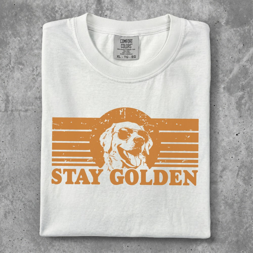 White t-shirt with "STAY GOLDEN" and a dog wearing sunglasses graphic.