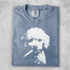 T-shirt with a distressed print of a white poodle smoking a cigarette.