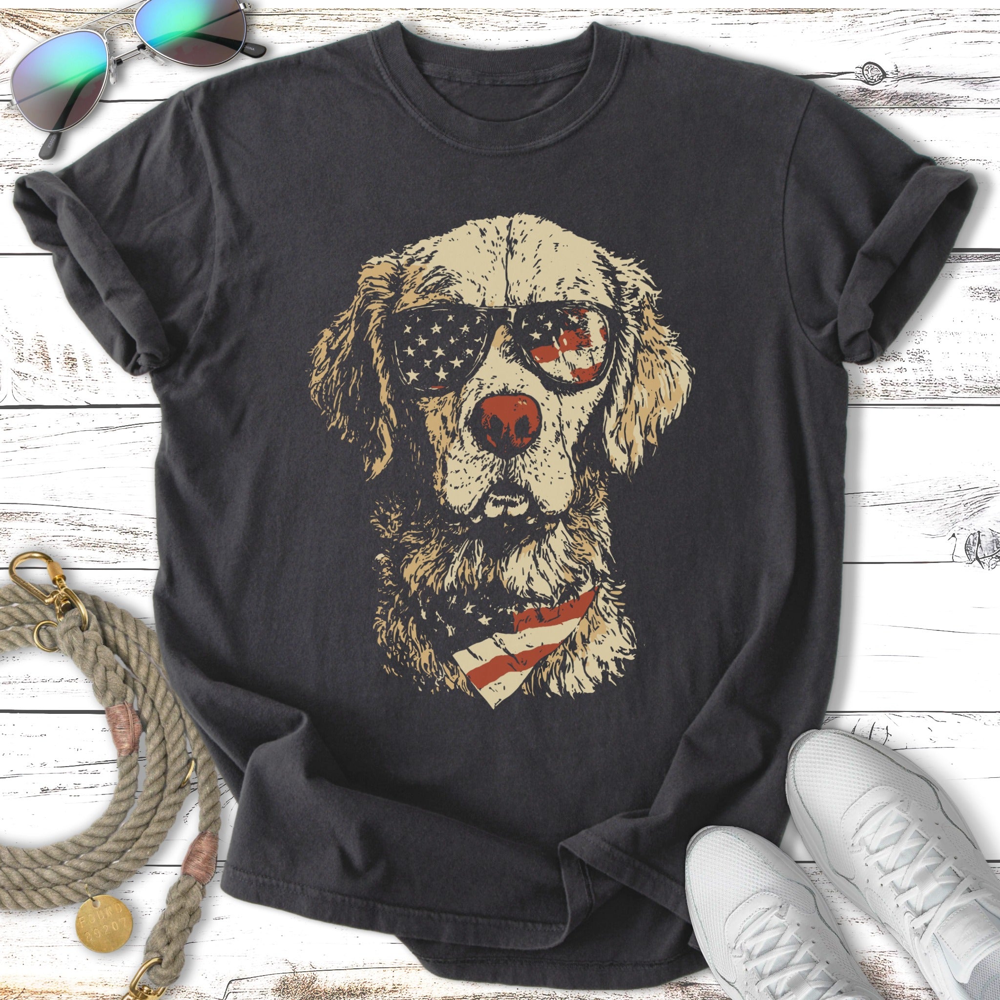Golden retriever wearing sunglasses and bandana.