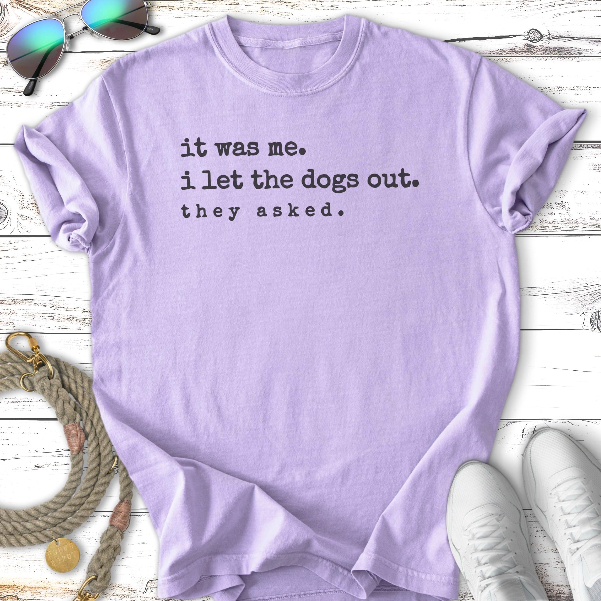 Light purple t-shirt with "it was me. i let the dogs out. they asked." text.