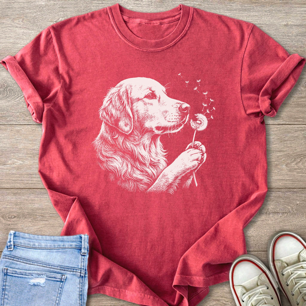 Red t-shirt with white sketch of a golden retriever blowing on a dandelion.