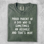 Olive green t-shirt with text "Proud parent of a dog who is sometimes an asshole and that's okay."