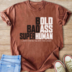 Rust-colored t-shirt with text "BOLD BADASS SUPERHUMAN...and I like my dog more than people".