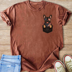 French bulldog in bandana and American flag sunglasses peeking from a pocket.