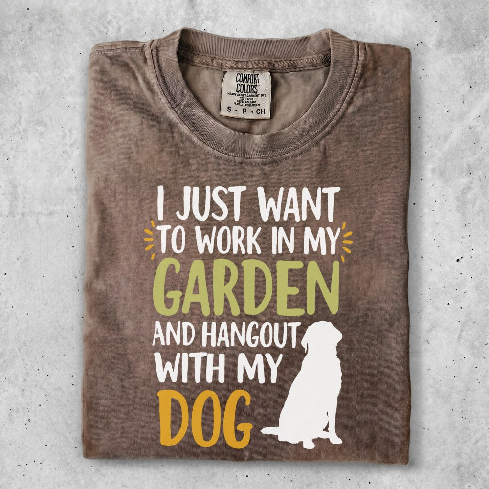 T-shirt with white graphic of dog and text about gardening and dogs.