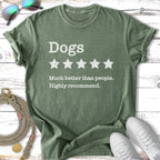 Green t-shirt with "Dogs, Much better than people. Highly recommend." text.