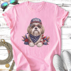 Dog wearing sunglasses and bandana with "USA" on cap.