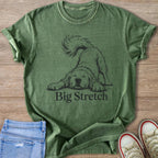 Green t-shirt with black line drawing of a dog stretching and text "Big Stretch".