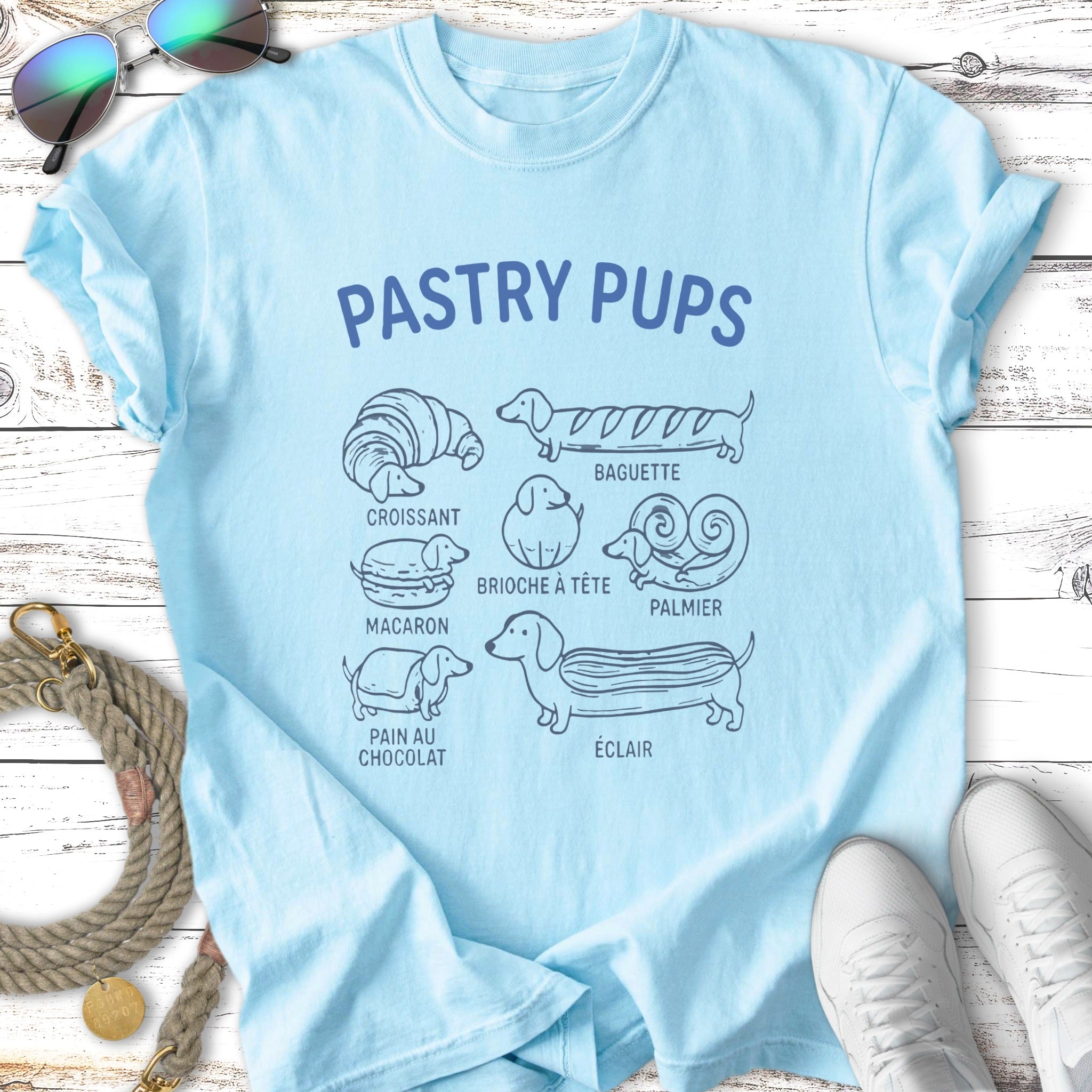 "Pastry Pups" t-shirt design with illustrated dog breeds as pastries.