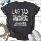 Dark t-shirt with "LAB TAX SNACK SAFETY INSPECTION UNIT" and snack illustrations.
