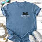 Blue t-shirt with a black cat peeking out and the text "JUDGING YOU SILENTLY."