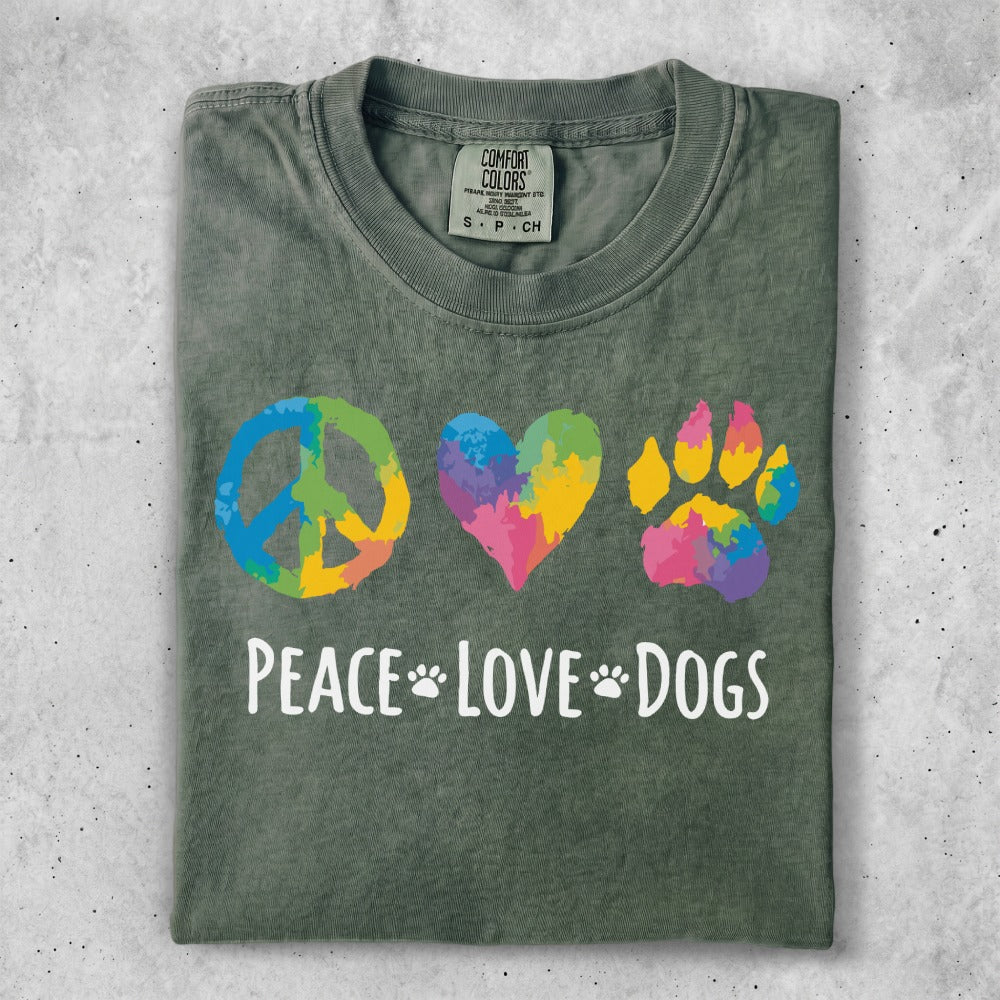 Green t-shirt with peace, heart, and paw print icons and "Peace Love Dogs" text.