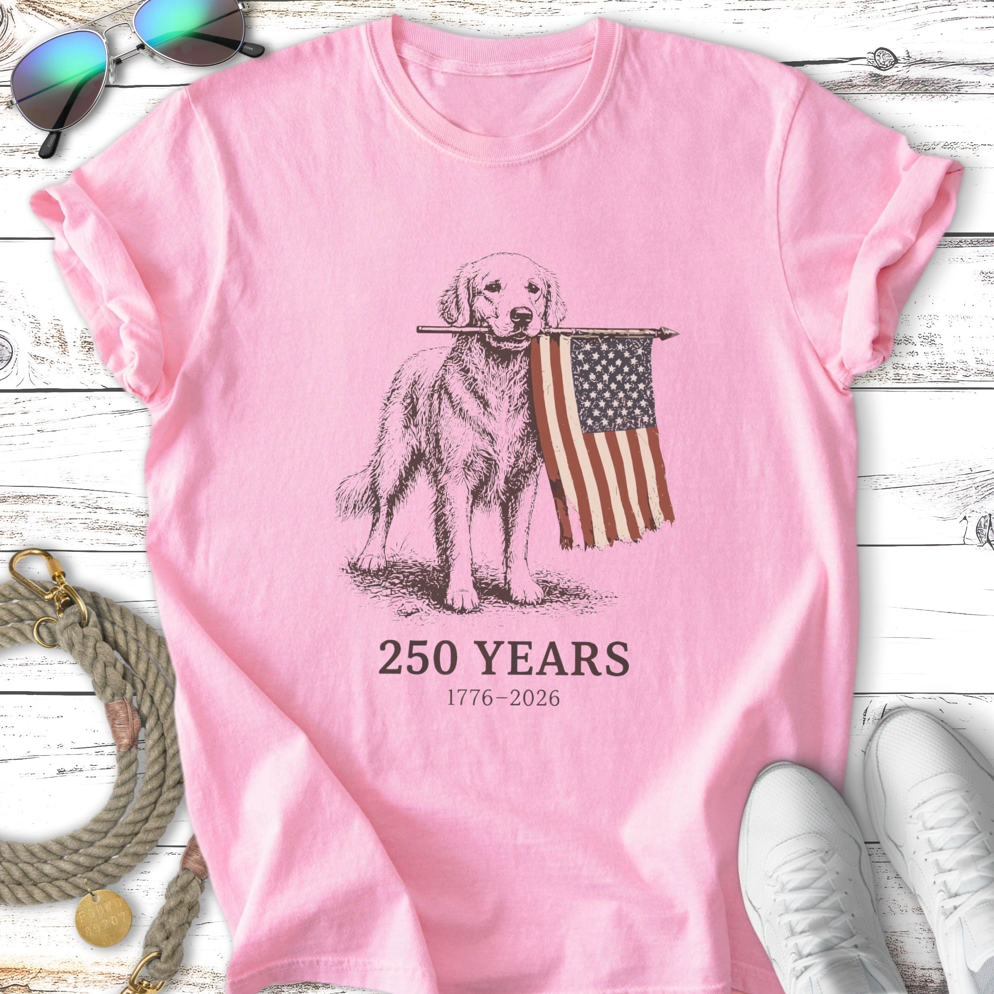 Golden retriever holding American flag, "250 YEARS 1776-2026".