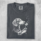 Charcoal t-shirt with a white line drawing of a dachshund holding a dandelion.