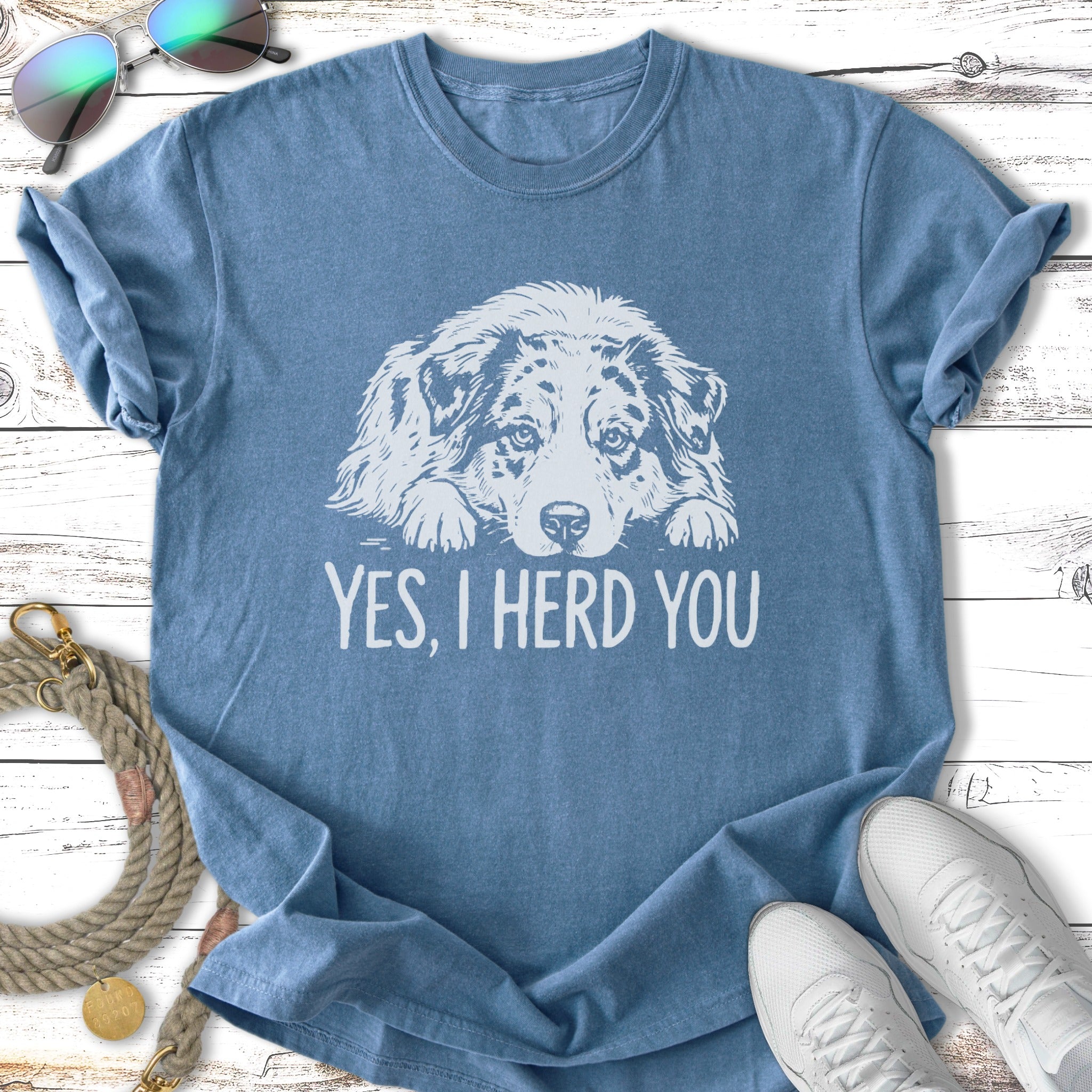 Blue t-shirt with a white dog graphic and text "YES, I HERD YOU".